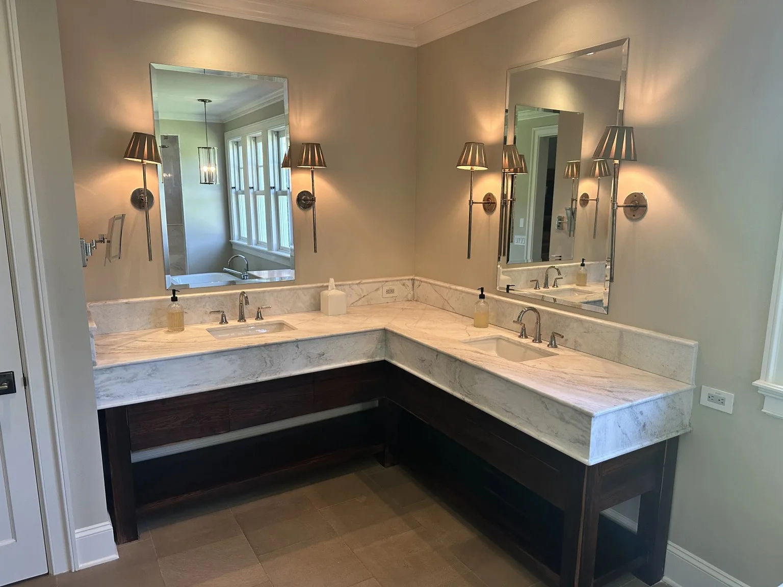Custom bathroom vanity with marble countertops and premium tile flooring
