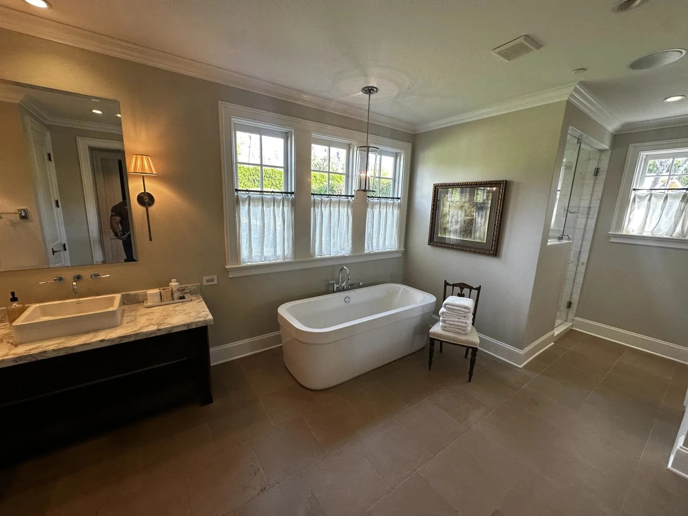 Large-format tile flooring in a luxury bathroom