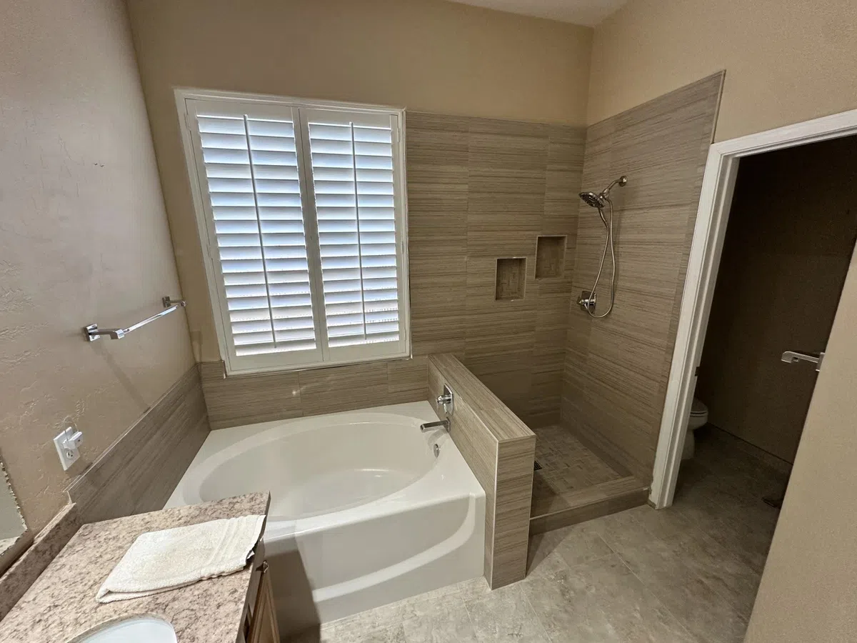 Luxury bathroom with tub surround and tile shower area